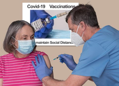 Senior male nurse with syringe injecting an elderly woman with the covid-19 vaccine in clinic or doctor office