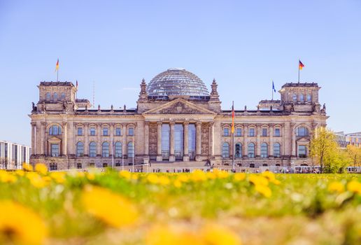 Picture of the Reichstag in Berlin in Springtime, green grass and flowers