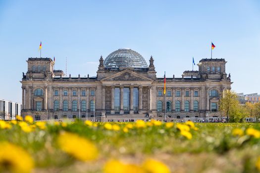 Picture of the Reichstag in Berlin in Springtime, green grass and flowers
