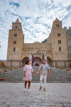 Cefalu, the medieval village of Sicily island, Province of Palermo, Italy. Europe, a couple on vacation at the Italian Island Sicilia