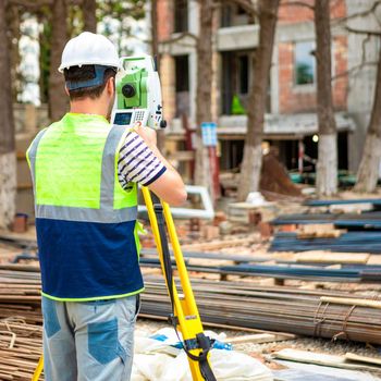 Construction topography worker on the building site