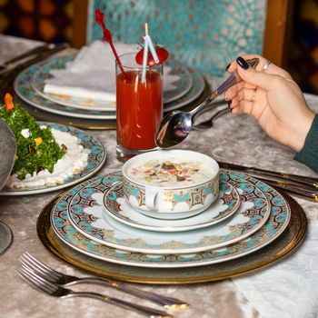 Woman eating yogurt based meal at the restaurant