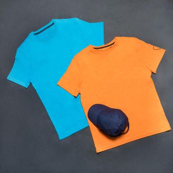 Blue and yellow man sport t-shirt with a blue cap isolated