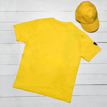 Yellow man sport t-shirt with a cap isolated