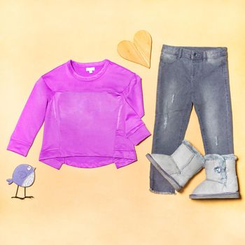 Purple girl top cloth with a jeans pants isolated