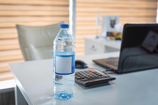 Plastic water bottle on the office desk