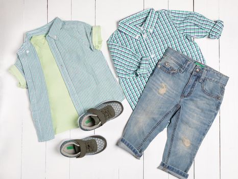 Men's casual outfits for man clothing set with t-shirt, gray shoes, shorts isolated on a white background, top view