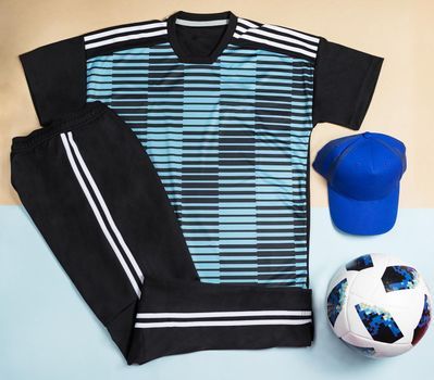 Blue soccer t-shirt design slim-fitting with a cap an ball top view