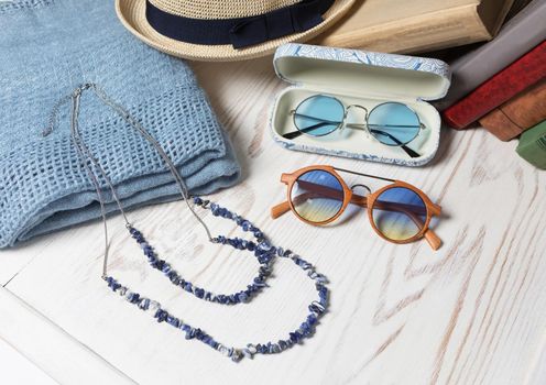 Female sunglasses hat and necklace close up