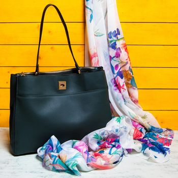 Black woman handbag with a scarf isolated