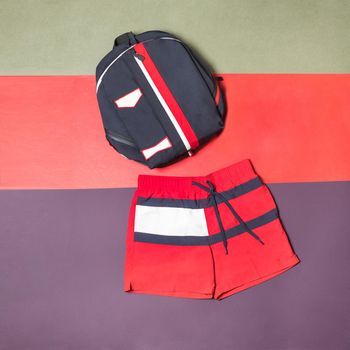 Red man short and backpack isolated top view