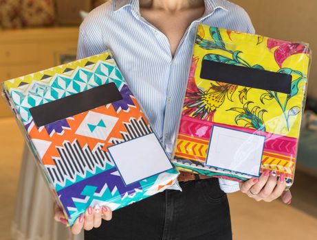 Woman holding colorful tablecloth set