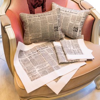 Set of colorful pillow on the showcase, newspaper style