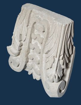 Plaster graceful decoration on the columns, dark background