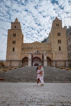 Cefalu, the medieval village of Sicily island, Province of Palermo, Italy. Europe, a couple on vacation at the Italian Island Sicilia