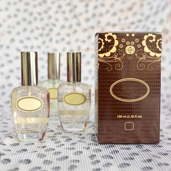 Perfume flacon with box on the white background