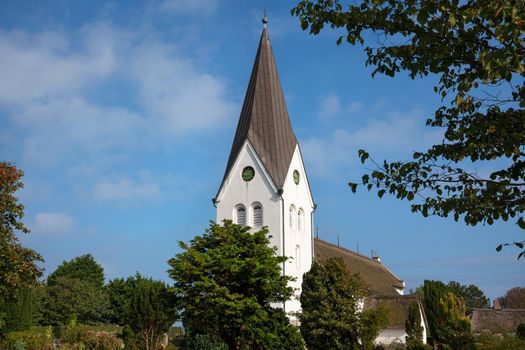 Old church of Nebel against blue sky, Amrum, Germany