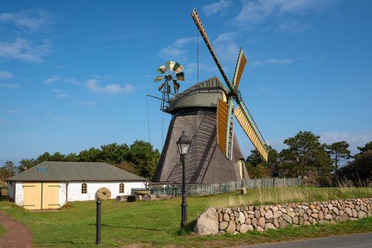 Panoramic image of the windmill of Nebel against blue sky, Amrum, Germany