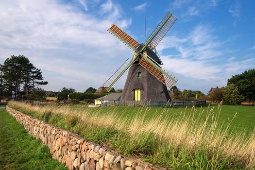 Panoramic image of the windmill of Nebel against blue sky, Amrum, Germany