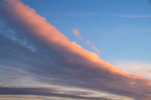 Early morning sky with pastel-colored clouds