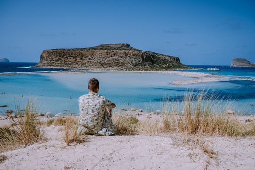 Balos Beach Cret Greece, Balos beach is on of the most beautiful beaches in Greece at the Greek Island young guy visit the beach during vacation