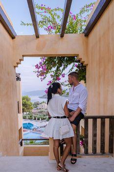 Crete Greece, Candia park village a luxury holiday village in Crete Greece by the ocean in traditional colors. Couple on vacation luxury resort