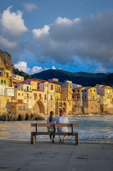 Cefalu, the medieval village of Sicily island, Province of Palermo, Italy. Europe, a couple on vacation at the Italian Island Sicilia