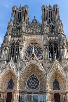 Low angle view at the front of cathedral Notre Dame in Reims, France