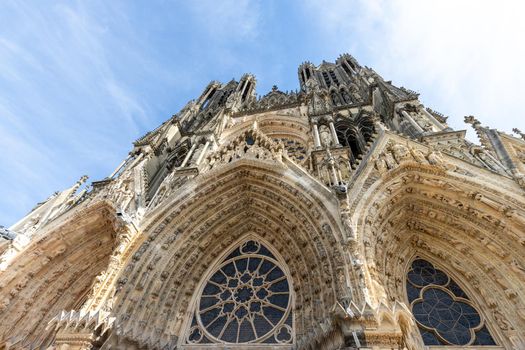 Low angle view at the front of cathedral Notre Dame in Reims, France