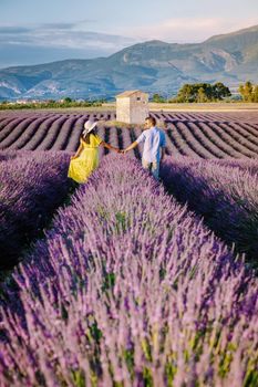 Provence, Lavender field France, Valensole Plateau, colorful field of Lavender Valensole Plateau, Provence, Southern France. Lavender field. Europe. Couple men and woman on vacation at the provence lavender fields,