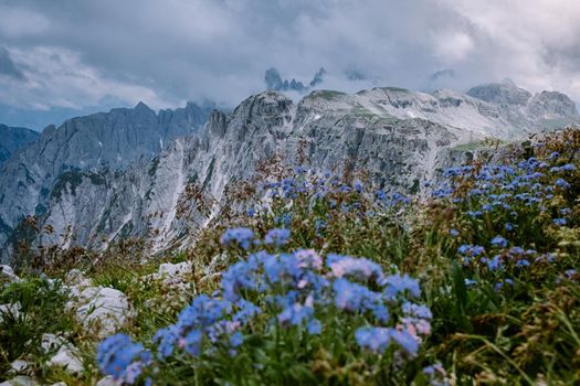 hiking in the italian dolomites during foggy weather with clouds, Stunning view to Tre Cime peaks in Dolomites, Italy. Europe
