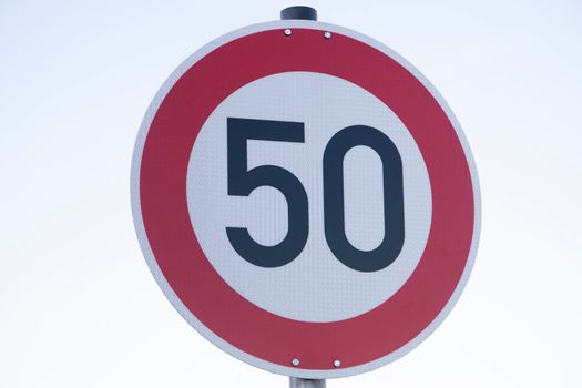 Speed limit traffic sign on white background
