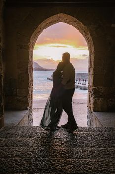 Cefalu, the medieval village of Sicily island, Province of Palermo, Italy. Europe, a couple on vacation at the Italian Island Sicilia