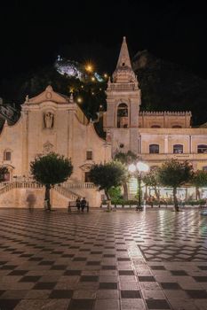 Taormina Sicily during sunset in the old town with narrow streets and lights. Sicily