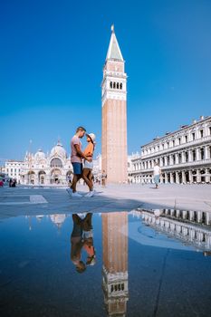 couple men and woman on a city trip to Venice Italy, colorful streets with canals Venice. Europe