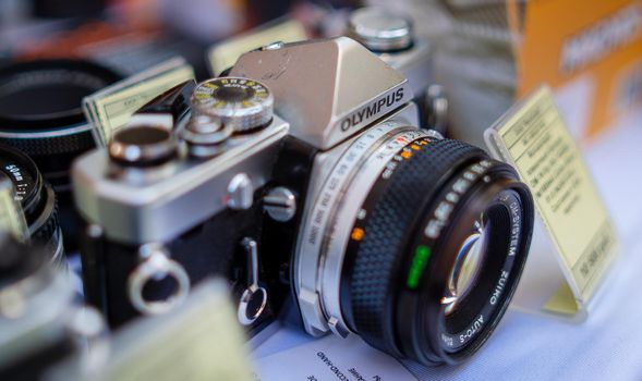August 18, 2018 Moscow, Russia. Manually operated 35mm single-lens reflex camera Olympus OM-1 on the counter of the store.