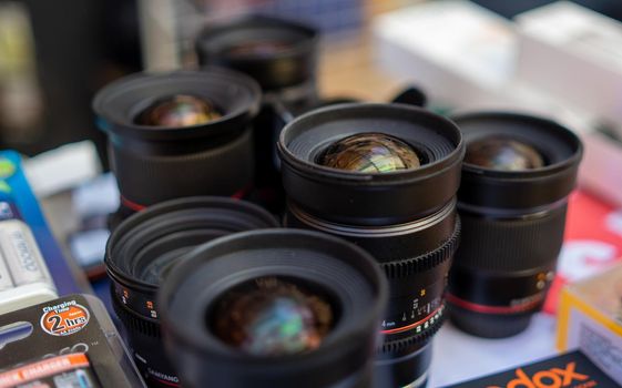 August 18, 2018 Moscow, Russia. Lenses for professional photo and video cameras from Samyang on the counter of the store.