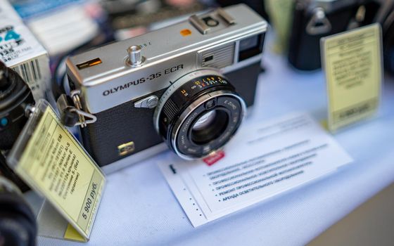 August 18, 2018 Moscow, Russia. Rangefinder camera Olympus 35 ECR on a shop counter.