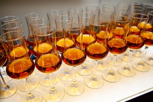 A lot of glasses with cognac.