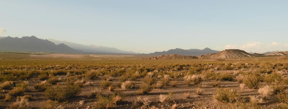 Vast arid valley in Uspallata, Mendoza, Argentina. Wide panoramic view.