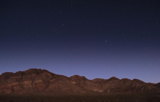Starry night sky over the mountains near Uspallata, Mendoza, Argentina.