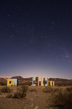 Starry night sky over a derelict house in the middle of the desert near Uspallata, Mendoza, Argentina.