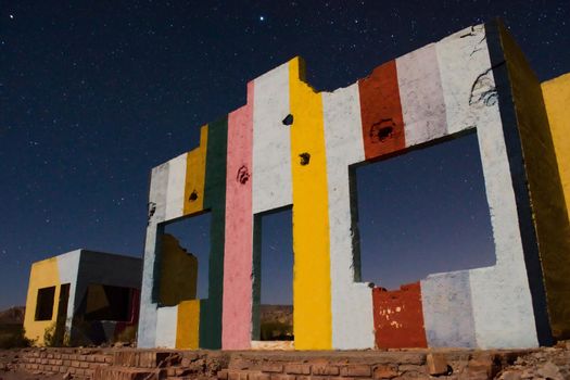 Starry night sky over a derelict house in the middle of the desert near Uspallata, Mendoza, Argentina.