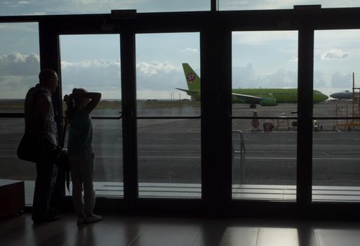SIMFEROPOL, RUSSIA, JULY 28, 2017 Silhouettes of passengers at the International Airport of Simferopol