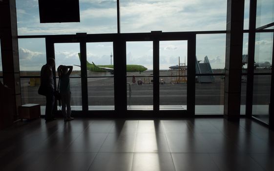 SIMFEROPOL, RUSSIA, JULY 28, 2017 Silhouettes of passengers at the International Airport of Simferopol