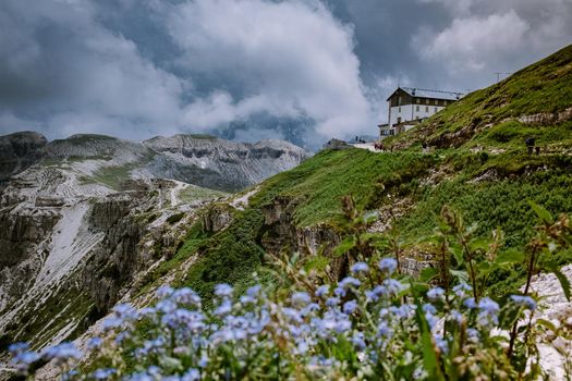 hiking in the italian dolomites during foggy weather with clouds, Stunning view to Tre Cime peaks in Dolomites, Italy. Europe