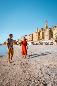 Menton France,couple men and woman on vacation at the Cote d Azur France, View on old part of Menton, Provence-Alpes-Cote d'Azur, France Europe