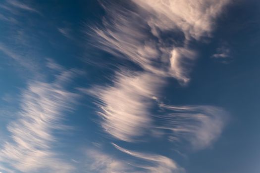 Cirrus clouds against a blue, deep blue sky.