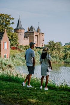 Muiderslot castle near Amsterdam - Netherlands, Muideslot during summer in the Netherlands. Europe Couple visiting Muiderslot on a trip