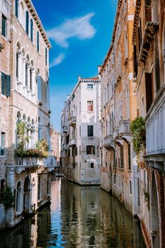 Beautiful venetian street in summer day, Italy. Venice Europe